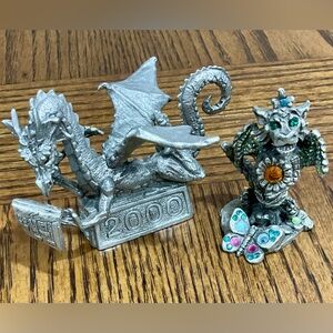 Pair of pewter dragons with colorful sparkles if you look closely